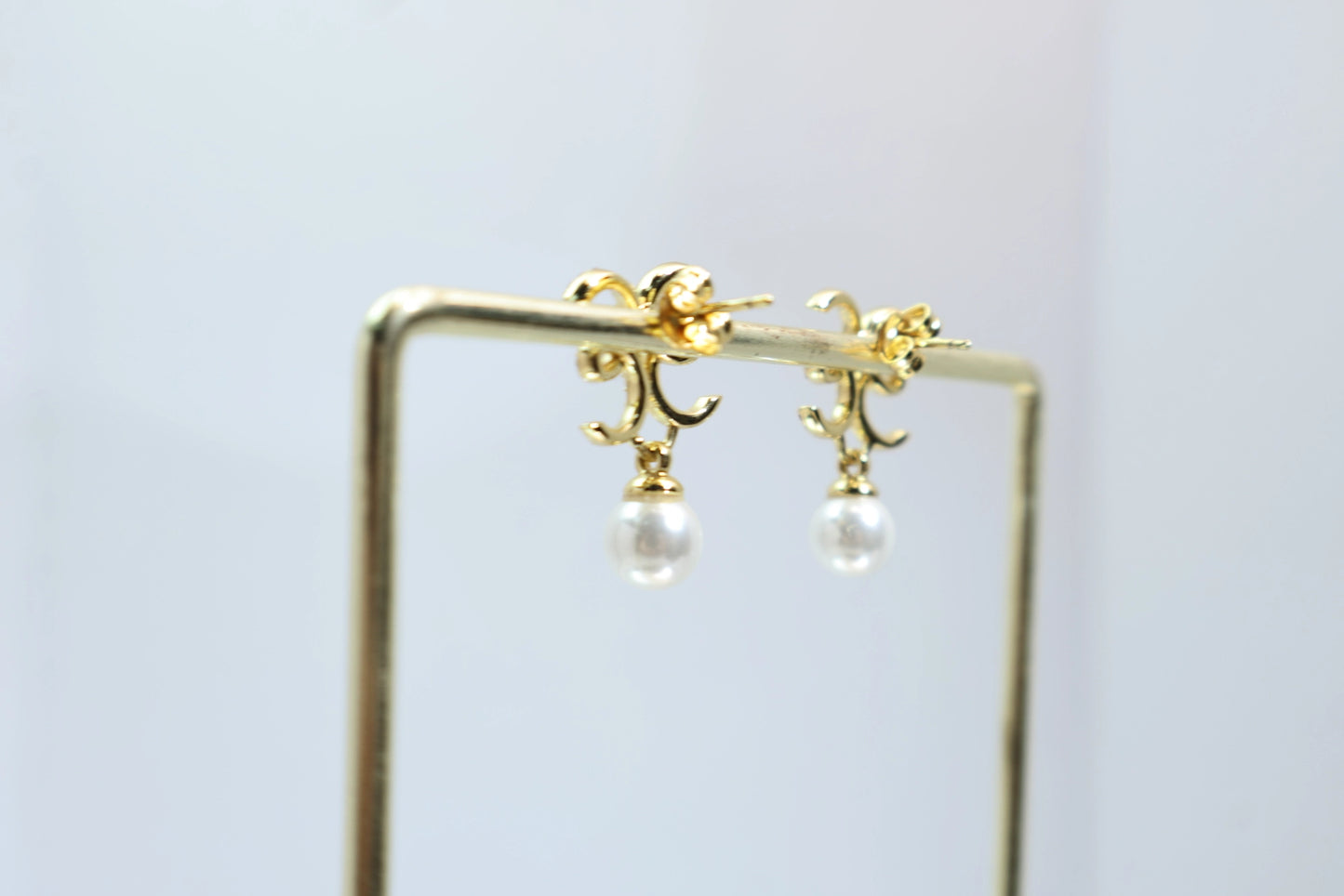 Chanel-style double C pearl earrings