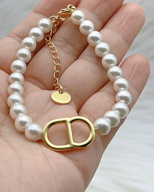 CD pearl bracelet worn on wrist gold plated supplier