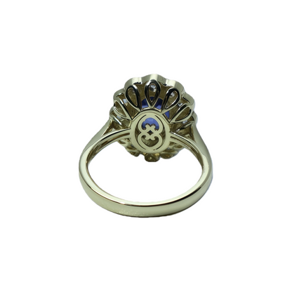 Garnet, moissanite, and blue spinel navel-shaped flower ring