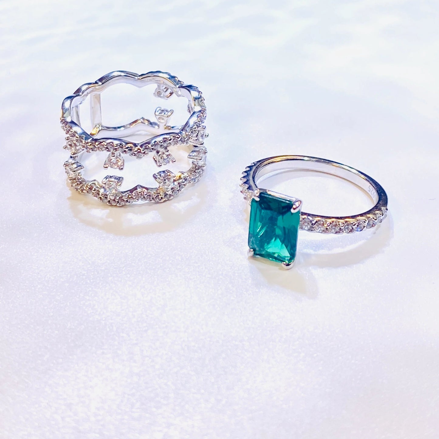 Elevate your collection with this stylish ring set, featuring a stunning 6x8mm rectangular lab-grown emerald. Inspired by popular fashion bloggers, this versatile set can be worn as a single statement piece or stacked for a layered look. Crafted from high-quality sterling silver with a durable 18K white gold plating, it offers both modern elegance and exceptional value.