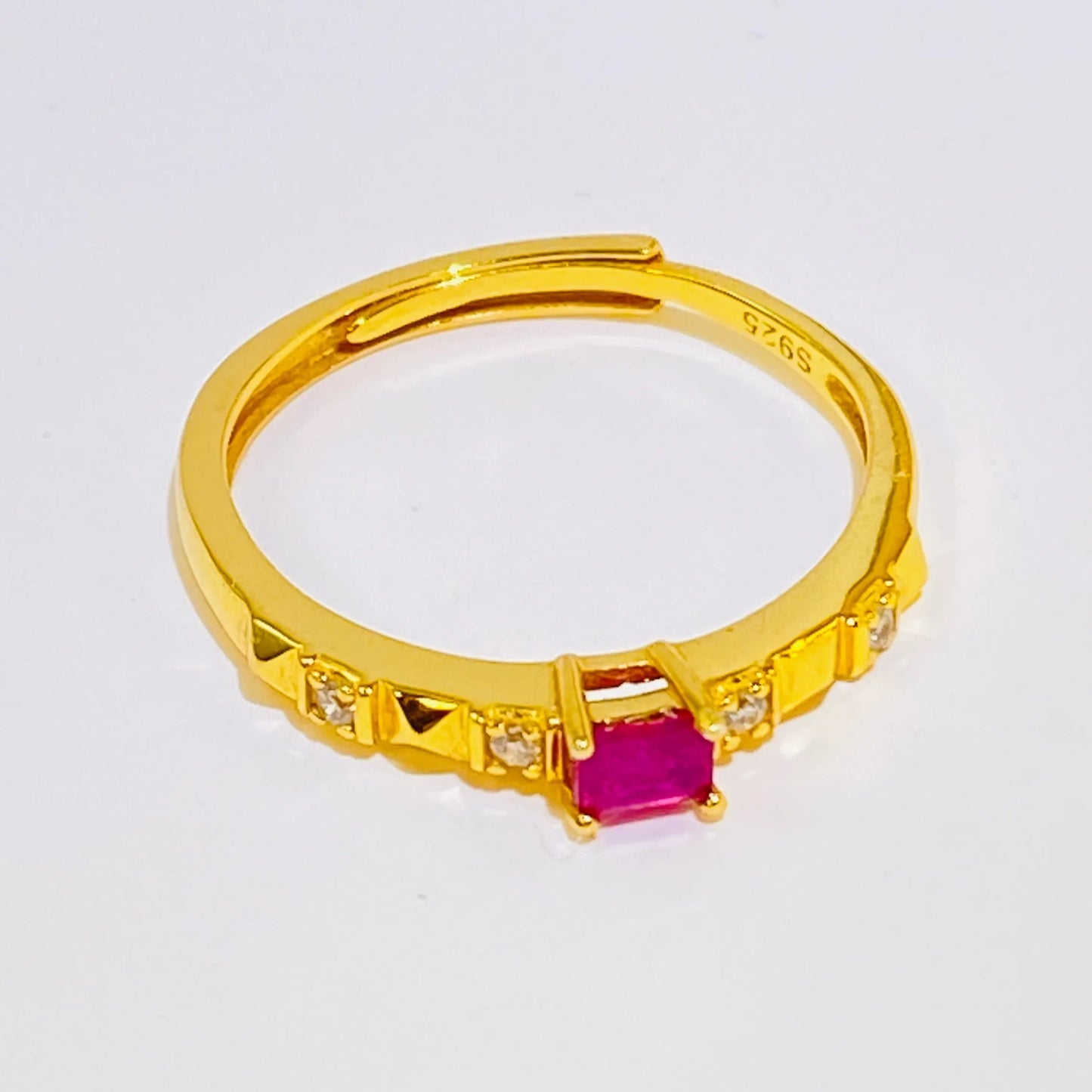Elevate your collection with this elegantly minimalist ring featuring a natural, untreated square ruby. Crafted from sterling silver and finished with a luxurious gold plating, this piece combines timeless style with modern simplicity. It's the perfect choice for wholesale buyers seeking high-quality, authentic gemstones in a fashionable, streamlined design.
