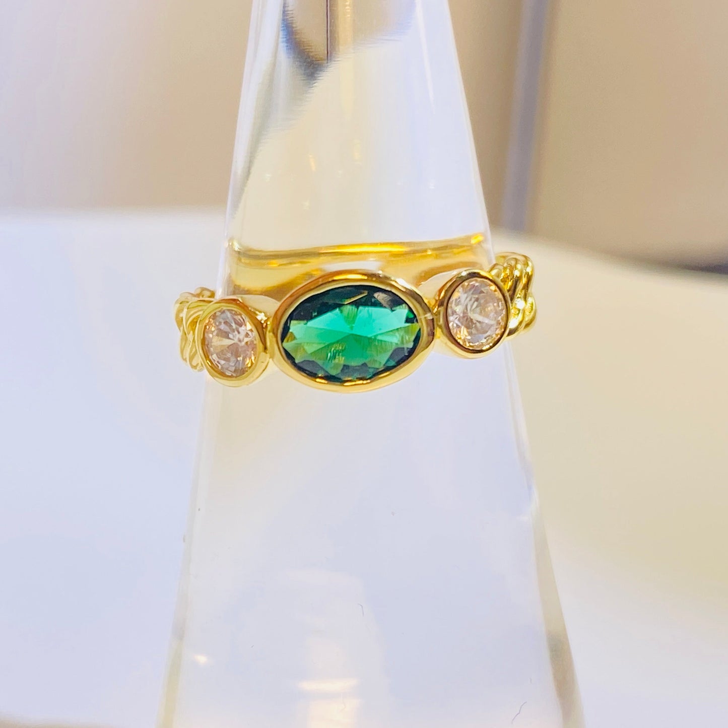 A best-selling design in the US and Europe, this trendy ring features a captivating 5x7mm oval lab-grown emerald. Its timeless appeal is crafted from sterling silver and finished with a brilliant 18K gold plating. The classic yet modern aesthetic is a flattering choice that beautifully complements any skin tone, making it a must-have for a curated jewelry collection.