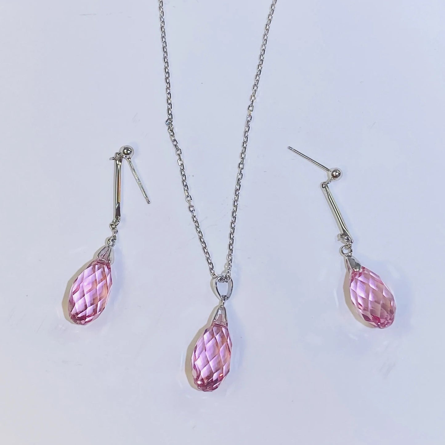 Introduce these elegant teardrop dangle earrings to your collection. They feature premium, precision-cut pink crystals with a stunning clarity and sparkle inspired by top European crystal houses. Crafted from durable 925 sterling silver, these earrings offer a sophisticated, luxurious aesthetic. A high-quality, fashionable choice for B2B buyers seeking timeless yet on-trend accessories.