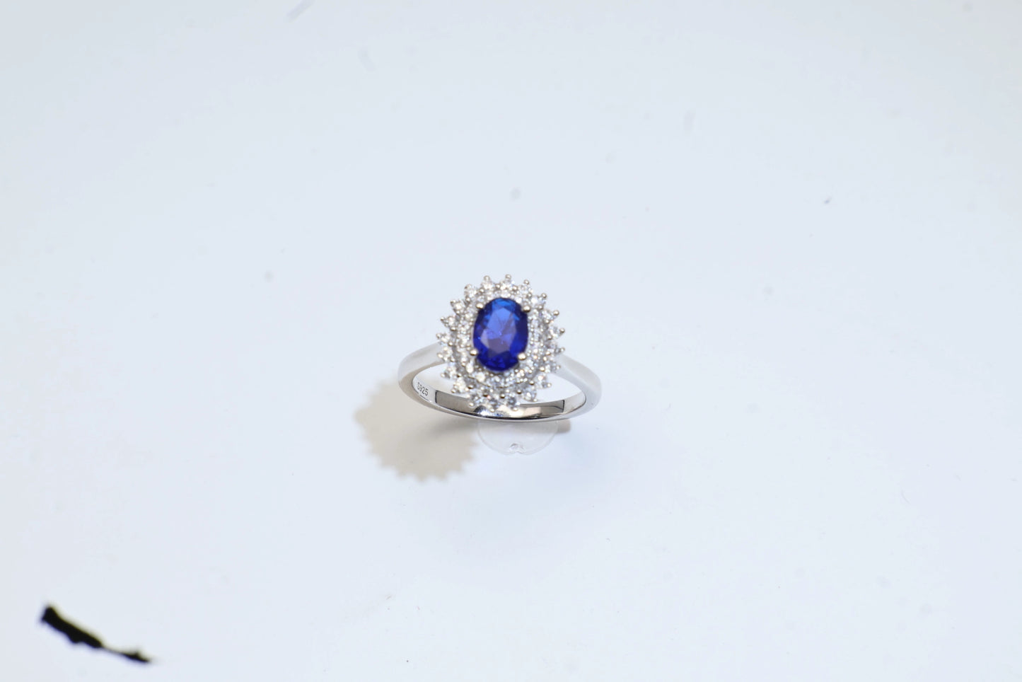 Oval Blue Spinel Halo Engagement Ring in White Gold Plated Silver