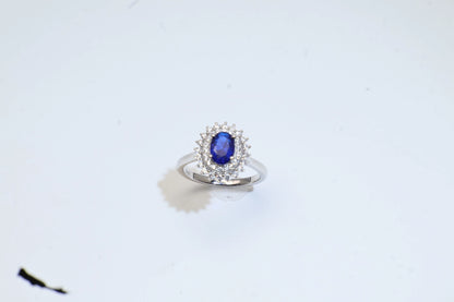 Oval Blue Spinel Halo Engagement Ring in White Gold Plated Silver