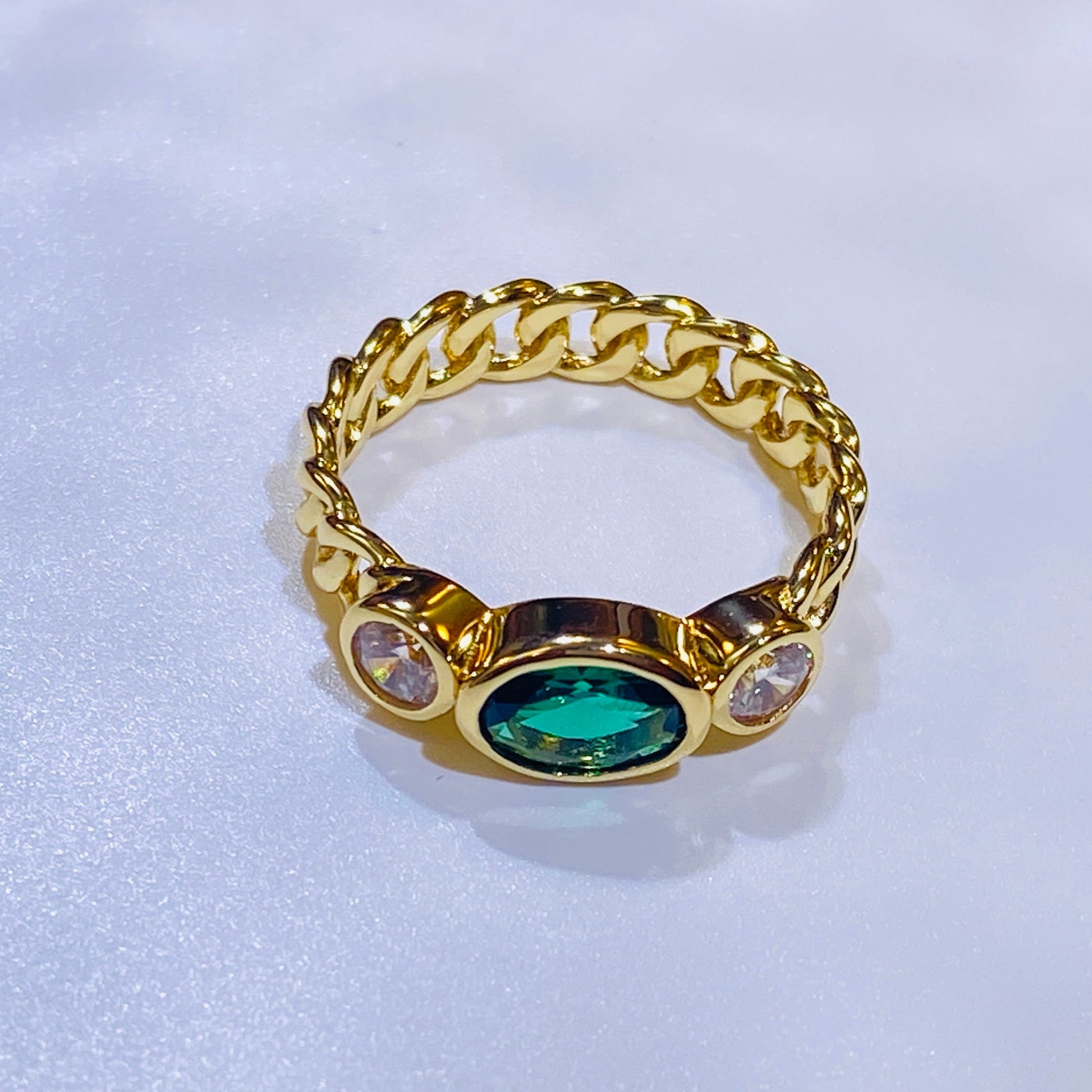 A best-selling design in the US and Europe, this trendy ring features a captivating 5x7mm oval lab-grown emerald. Its timeless appeal is crafted from sterling silver and finished with a brilliant 18K gold plating. The classic yet modern aesthetic is a flattering choice that beautifully complements any skin tone, making it a must-have for a curated jewelry collection.