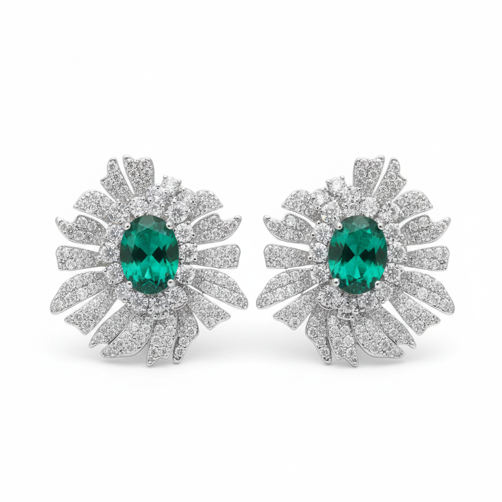 Emerald green oval sunburst pavé CZ stud earrings, white background product photo, silver plated