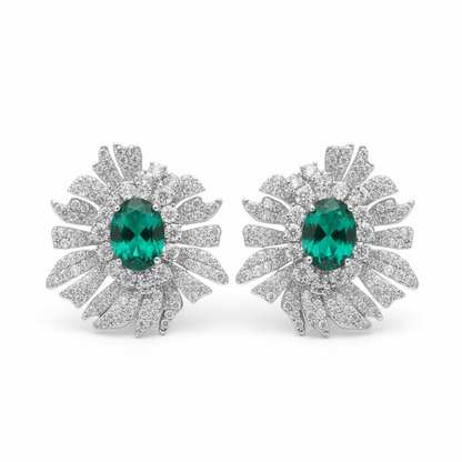 Emerald green oval sunburst pavé CZ stud earrings, white background product photo, silver plated