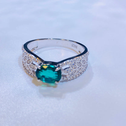 A perennial favorite among our European and American clients, this classic ring features a stunning 5x7mm oval lab-grown emerald. Its timeless and elegant design is crafted from sterling silver and finished with a brilliant 18K white gold plating, making it a sophisticated choice that beautifully complements any skin tone. A must-have for any curated jewelry collection.